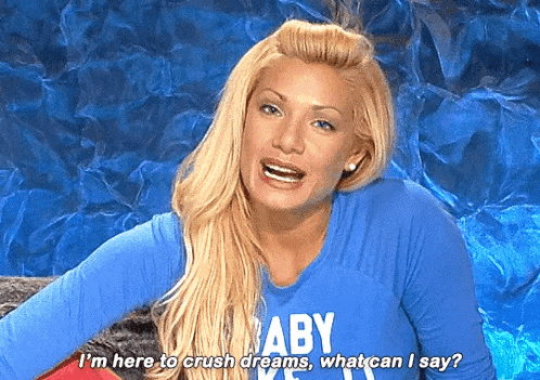 a woman wearing a blue baby shirt says i 'm here to crush dreams what can i say ?