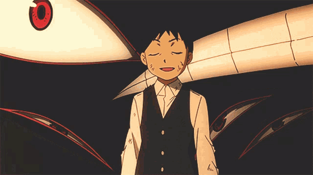 a boy in a black vest and white shirt stands in front of a large white object with red eyes