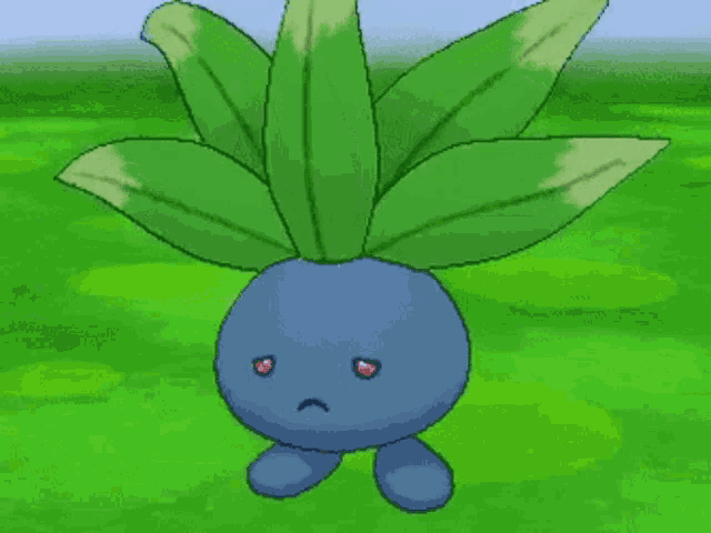 a blue pokemon with a sad face is standing in a grassy field