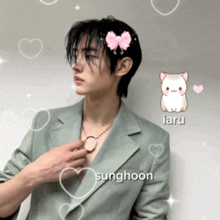 a man with a bow in his hair and the name sunghoon on his chest