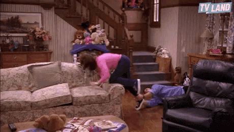 a living room with a sign that says tv land in the corner