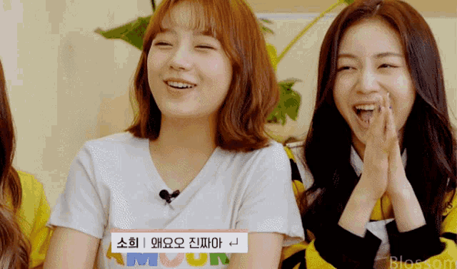 a girl wearing a white shirt that says blossom on it