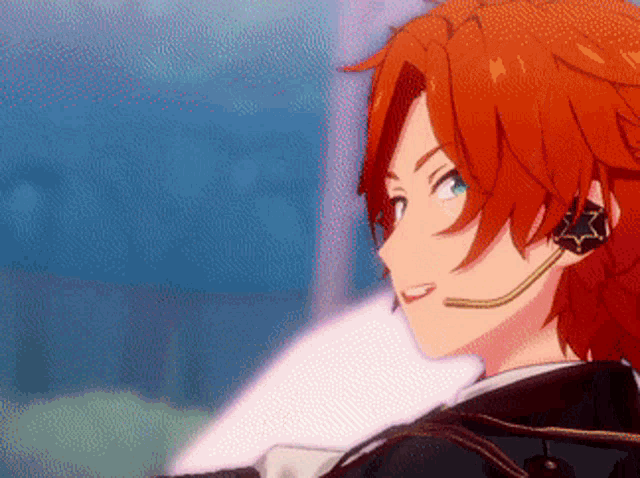 a boy with red hair and a microphone on his ear .