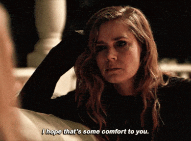 a woman with long red hair says i hope that 's some comfort to you