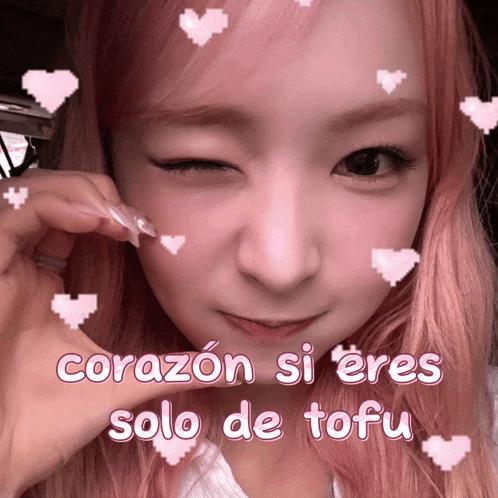 a girl with pink hair has hearts on her face and the words corazon si eres solo de tofu
