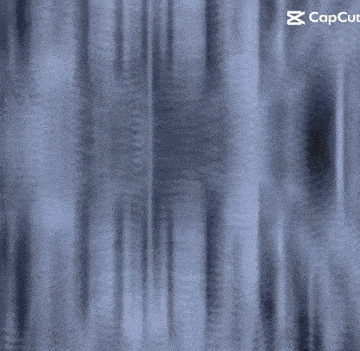 a blurred image of a person 's face with a capcut logo in the corner