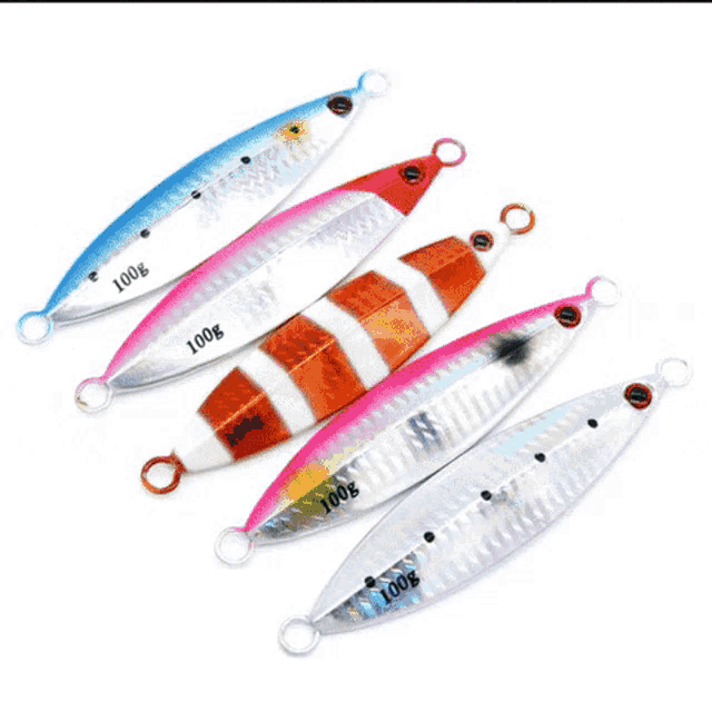 a person is holding a fish with a blue lure in its mouth and a fishing tackle logo in the corner