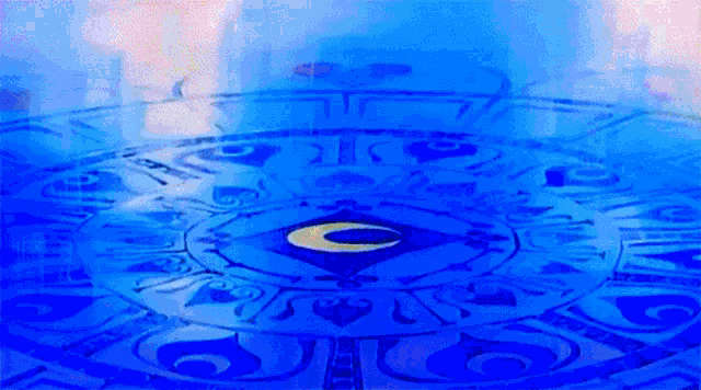 a blue circle with a yellow letter c in the center