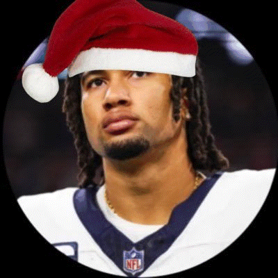 a football player wearing a santa hat and a nfl jersey .