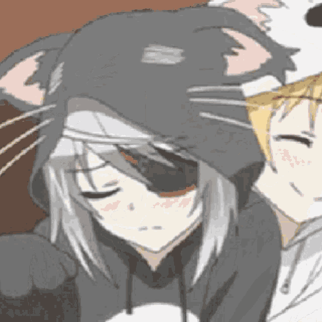 a boy and a girl are sitting next to each other . the girl is wearing a cat hooded sweatshirt .