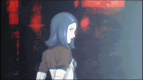 a woman with blue hair is standing in front of a red light