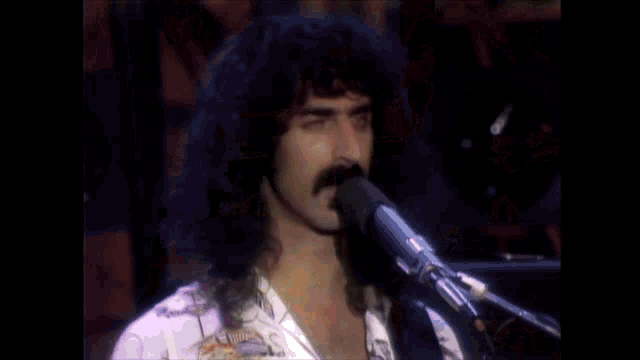 a woman playing drums with the word stinkfoot written on the bottom
