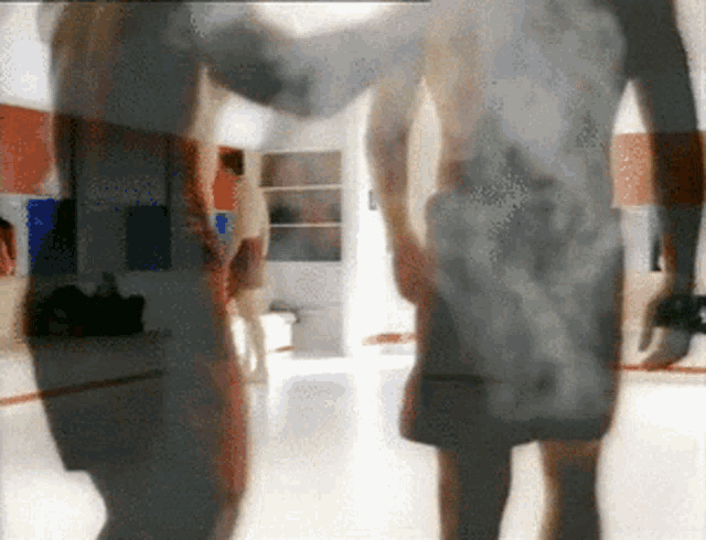 a blurry picture of a man and woman holding hands