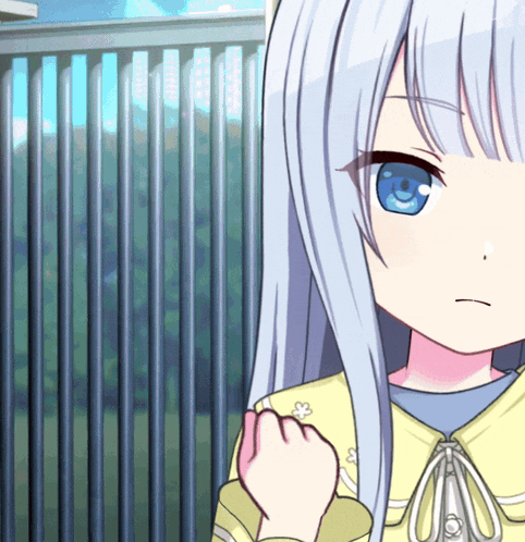 a girl with long white hair and blue eyes stands in front of a metal fence