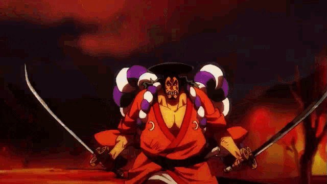 a man in a red kimono is holding two swords in front of a fire explosion .