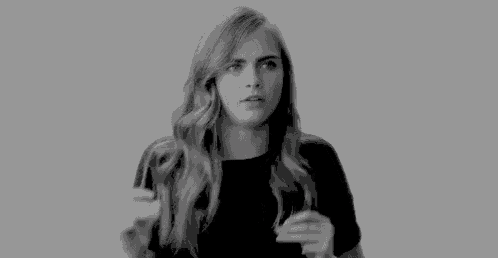 a black and white photo of a woman with long blonde hair .