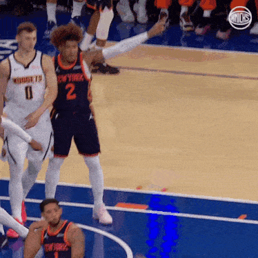 a basketball player wearing a jersey that says new york