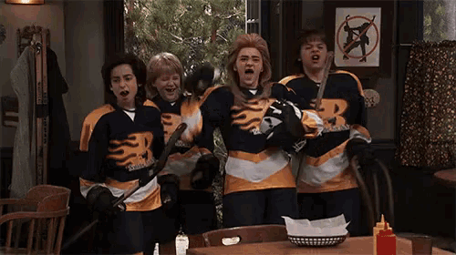 a group of hockey players wearing jerseys that say r on them