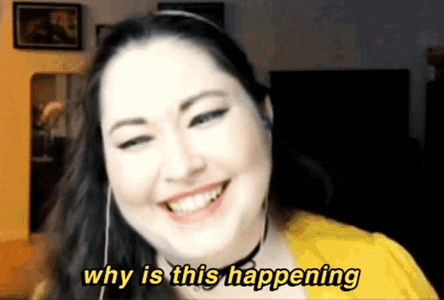 a woman is smiling with the words why is this happening behind her