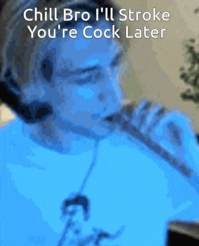 a man in a blue shirt is singing into a microphone with the words chill bro i 'll stroke youre cock later