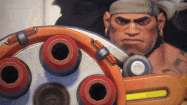 a man with a bandana on his head is standing next to a machine that has a yellow bar on it