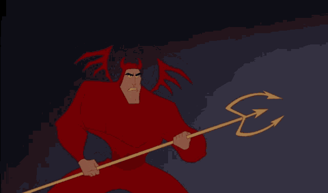 a man in a red devil costume is holding a trident with the letter s on it