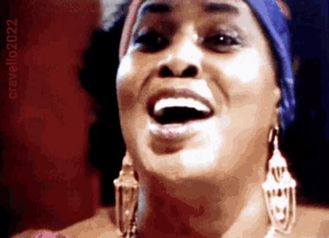 a close up of a woman 's face with the words cravello2022 above her