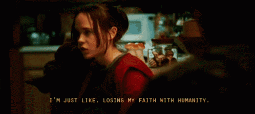 a woman in a red shirt says " i 'm just like losing my faith with humanity " in a dark room