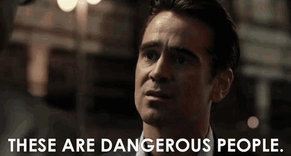 a man says " these are dangerous people " in front of a dark background
