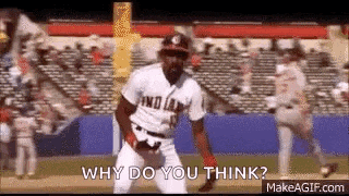 a man in a baseball uniform is standing on a field and asking why do you think .