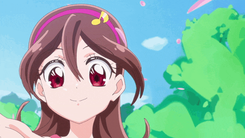 a close up of a girl with a pink headband