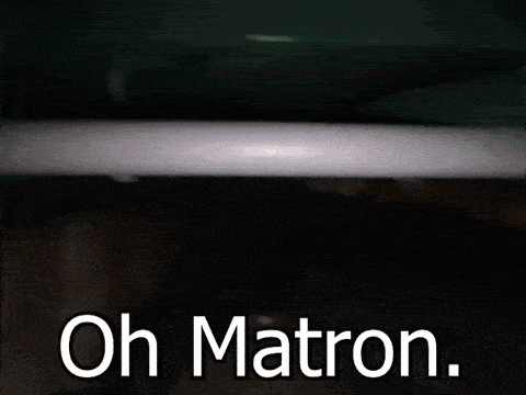 a hand is hanging from a pipe with the words oh matron below it .