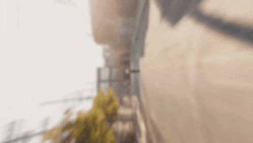 a blurry photo of a person walking down a street