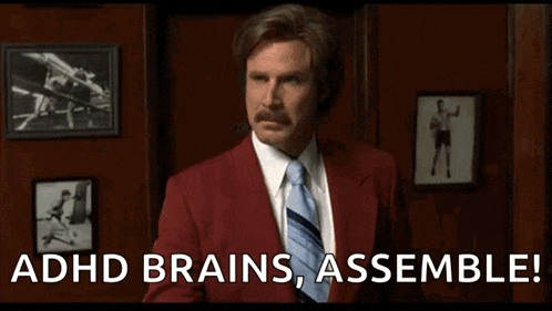 a man in a red suit and tie is saying adhd brains , assemble !