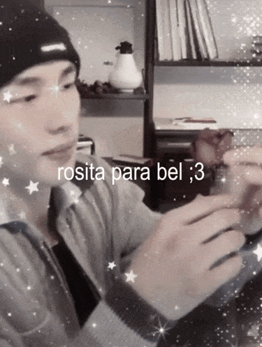 a man wearing a beanie and a sweater with the words rosita para bel