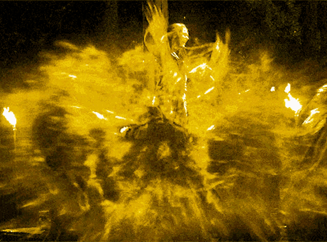 a painting of a person surrounded by flames in the dark
