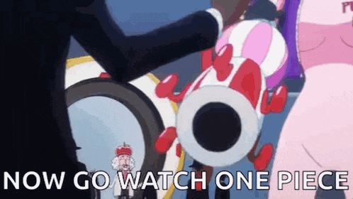 a man in a suit is holding a pink and red balloon with the words `` now go watch one piece '' .