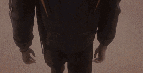 a close up of a person 's back with a backpack on their back .