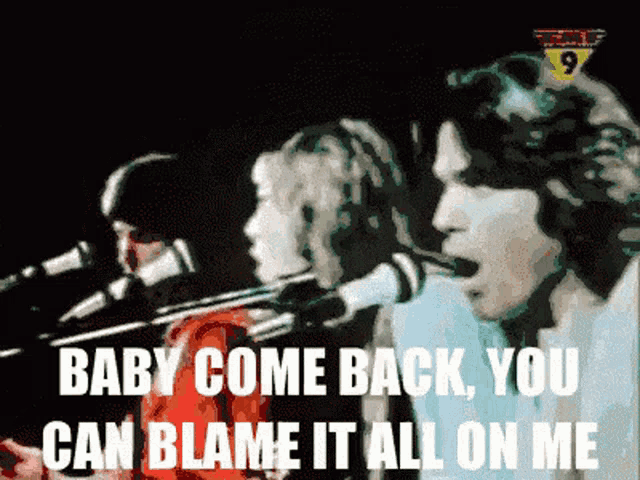 a group of people singing in front of microphones with the words baby come back you can blame it all on me
