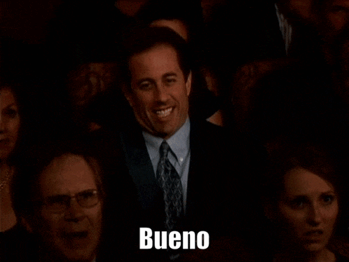 a man in a suit and tie is waving in a crowd with the words suficiente northius por hoy