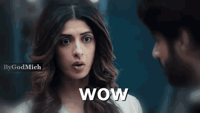 a woman with a surprised look on her face and the word wow on the bottom right