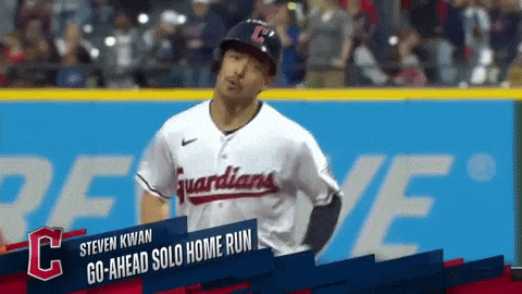 a baseball player named steven kwan is standing on the field