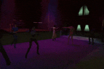 a group of people dancing in a dark room with purple lights