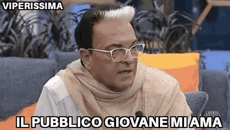 a man wearing glasses and a scarf says viperissima