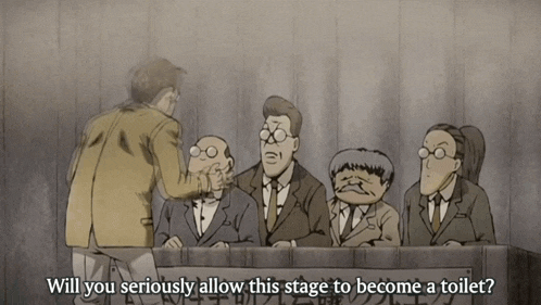 a group of men are sitting in front of a sign which says will you seriously allow this stage to become a toilet
