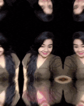 a woman in a brown dress is surrounded by a bunch of other women