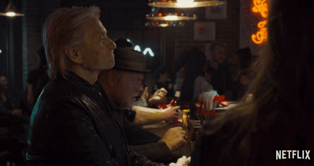 a man sitting at a bar says " i guess not " in a netflix ad