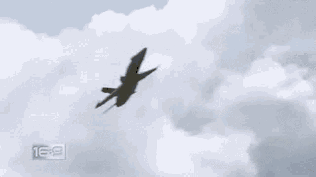 a large explosion in a field with the number 16 9 in the corner