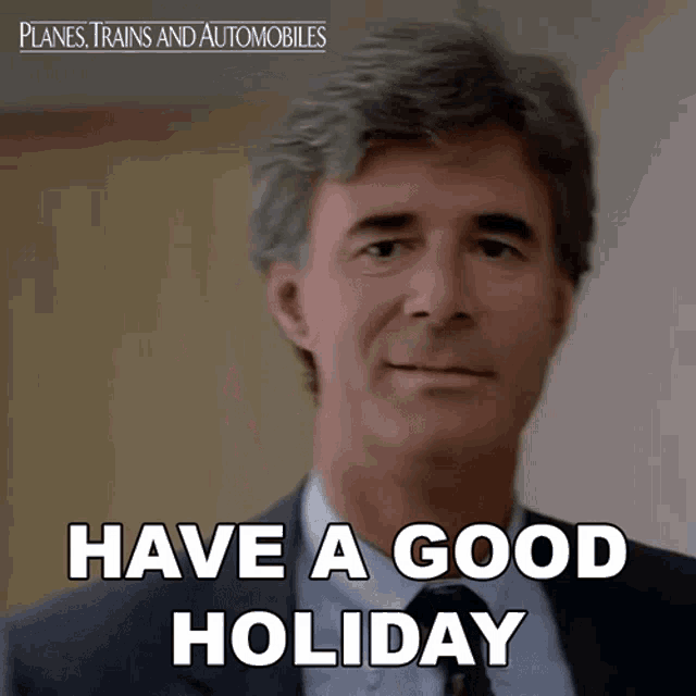 a man in a suit and tie with the words have a good holiday below him