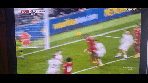a soccer game is being shown on a tv screen